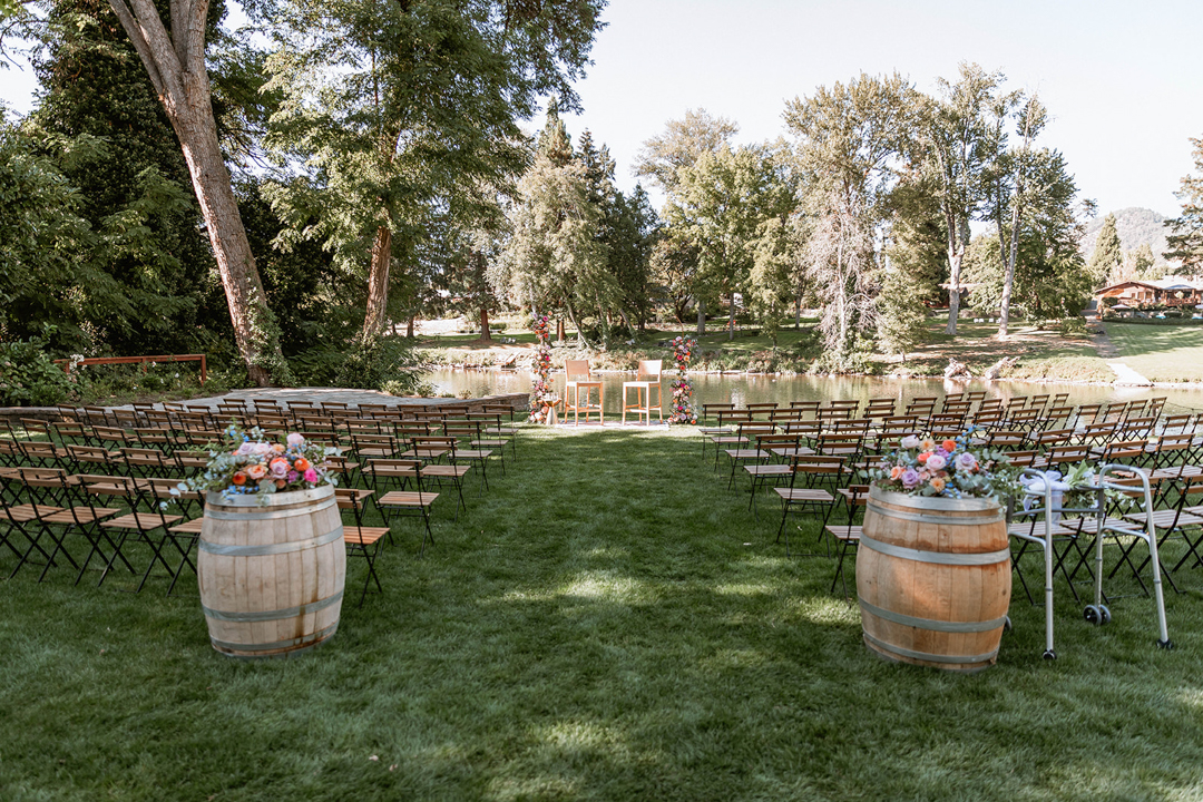 A River House Ceremony Location with Chairs and flower arch set up